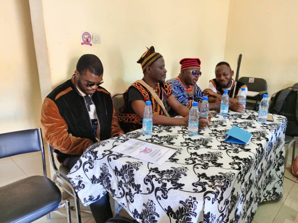 PICTURE OF THE HSUVI STAFF SEATED ON THE TABLE 